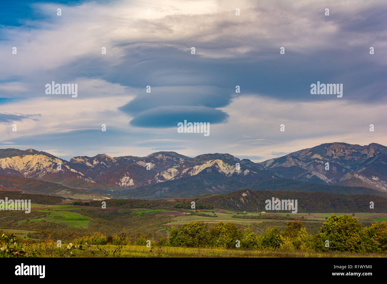 Amazing beautiful cloud over the mountain range Stock Photo - Alamy