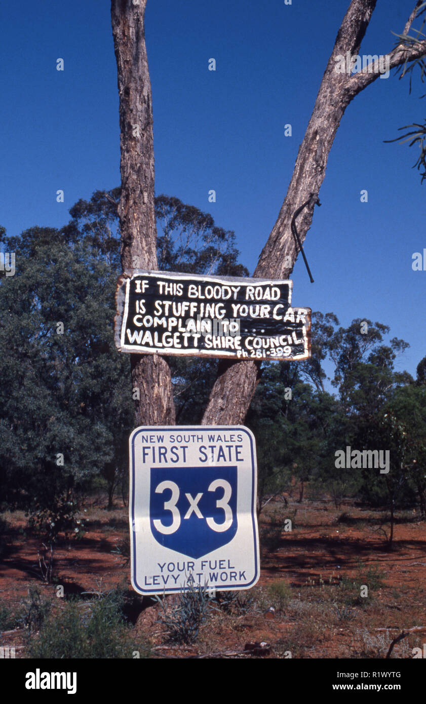 IF THIS BLOODY ROAD IS STUFFING UP YOUR CAR, COMPLAIN TO THE WALGETT SHIRE (ROAD SIGN) NEW SOUTH WALES, AUSTRALIA. Stock Photo