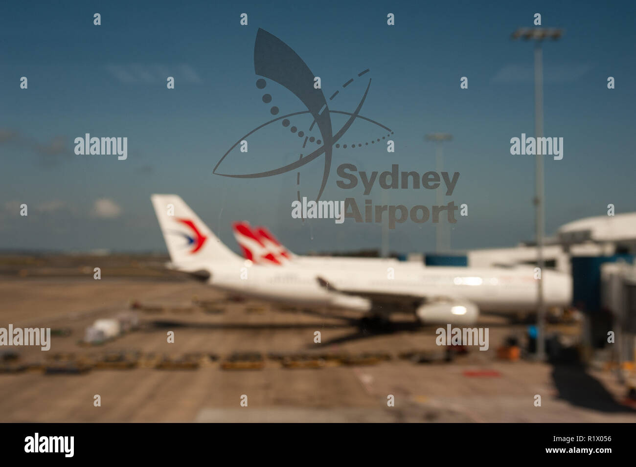 23.09.2018, Sydney, New South Wales, Australia - View through a window of docked aeroplanes at Sydney's International Airport Kingsford Smith. Stock Photo