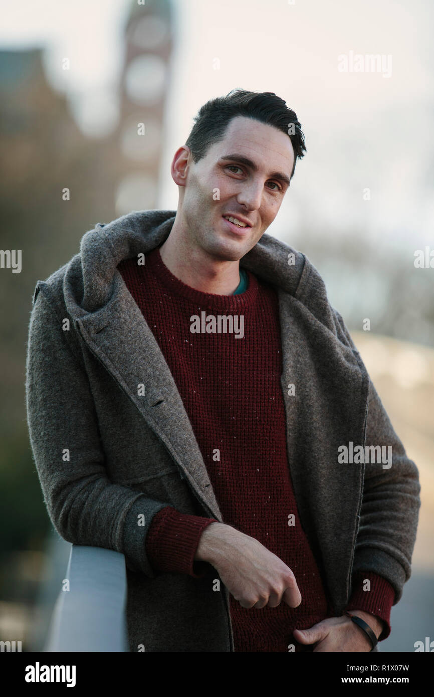Outdoor Young man Winter Portrait walking in the city Stock Photo