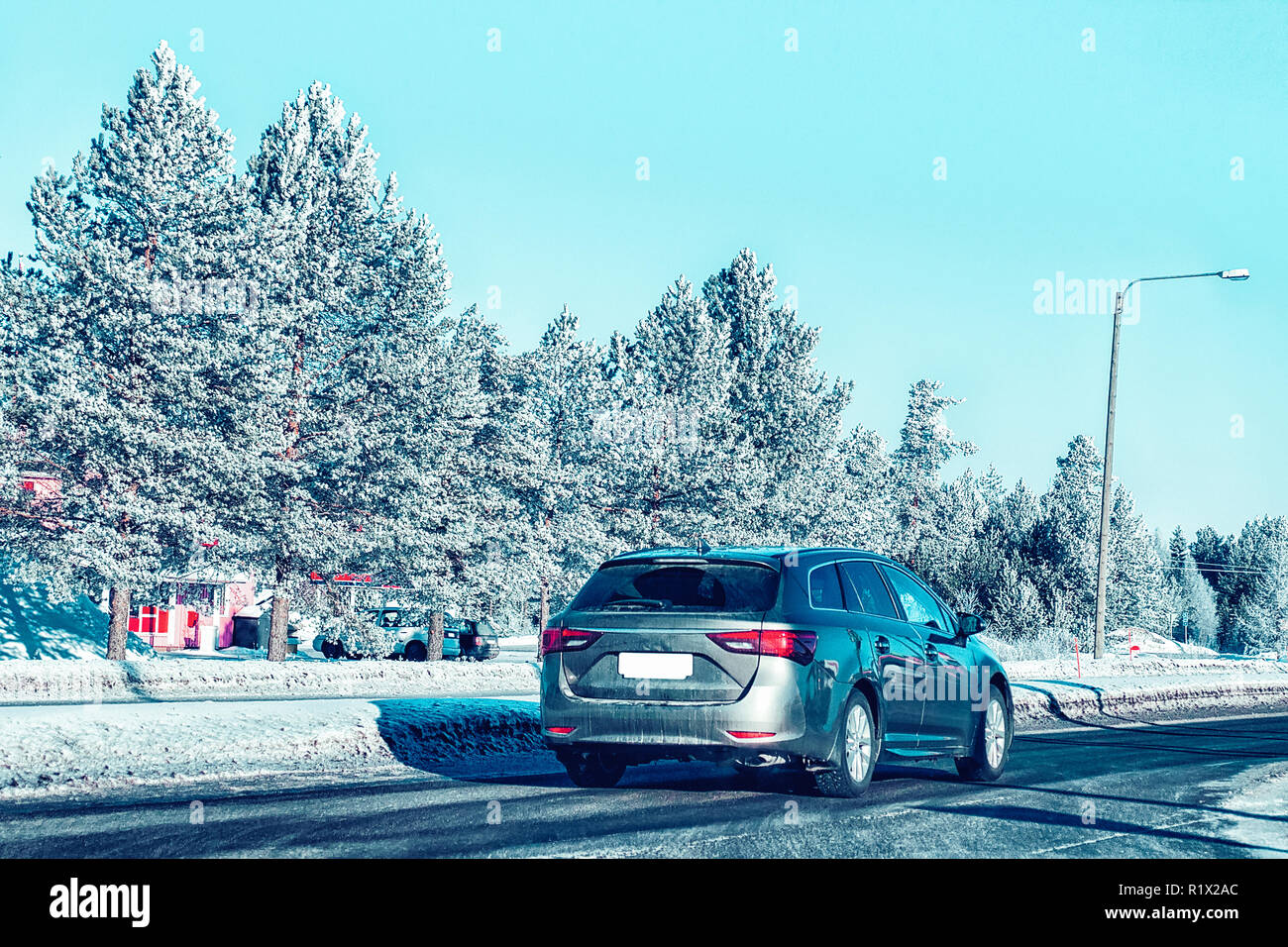 Car in the winter road in Rovaniemi in Lapland, in Finland Stock Photo