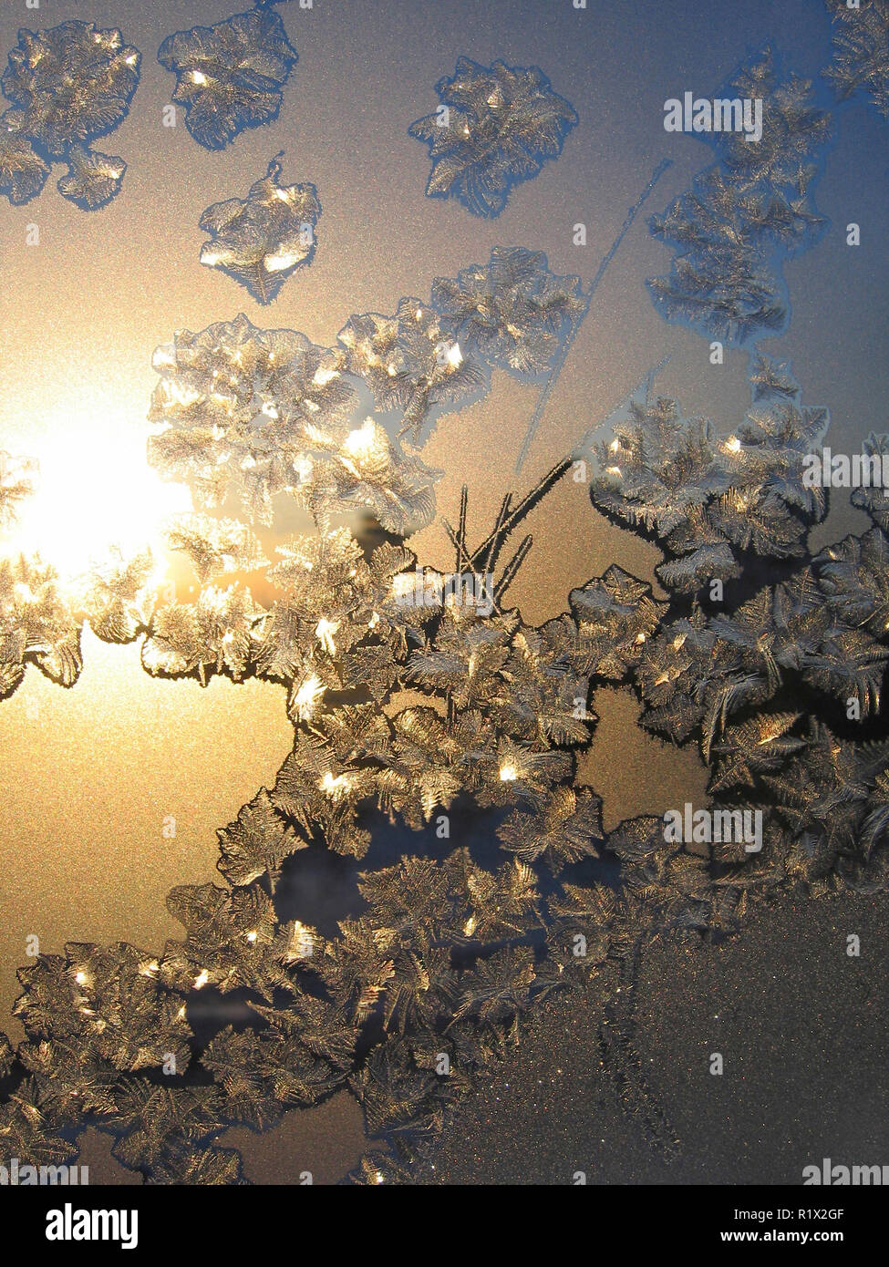 Frosty natural pattern and sunlight on winter window Stock Photo - Alamy