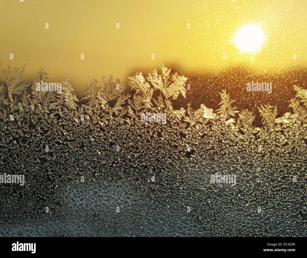 frosty natural pattern and sun on winter window Stock Photo - Alamy