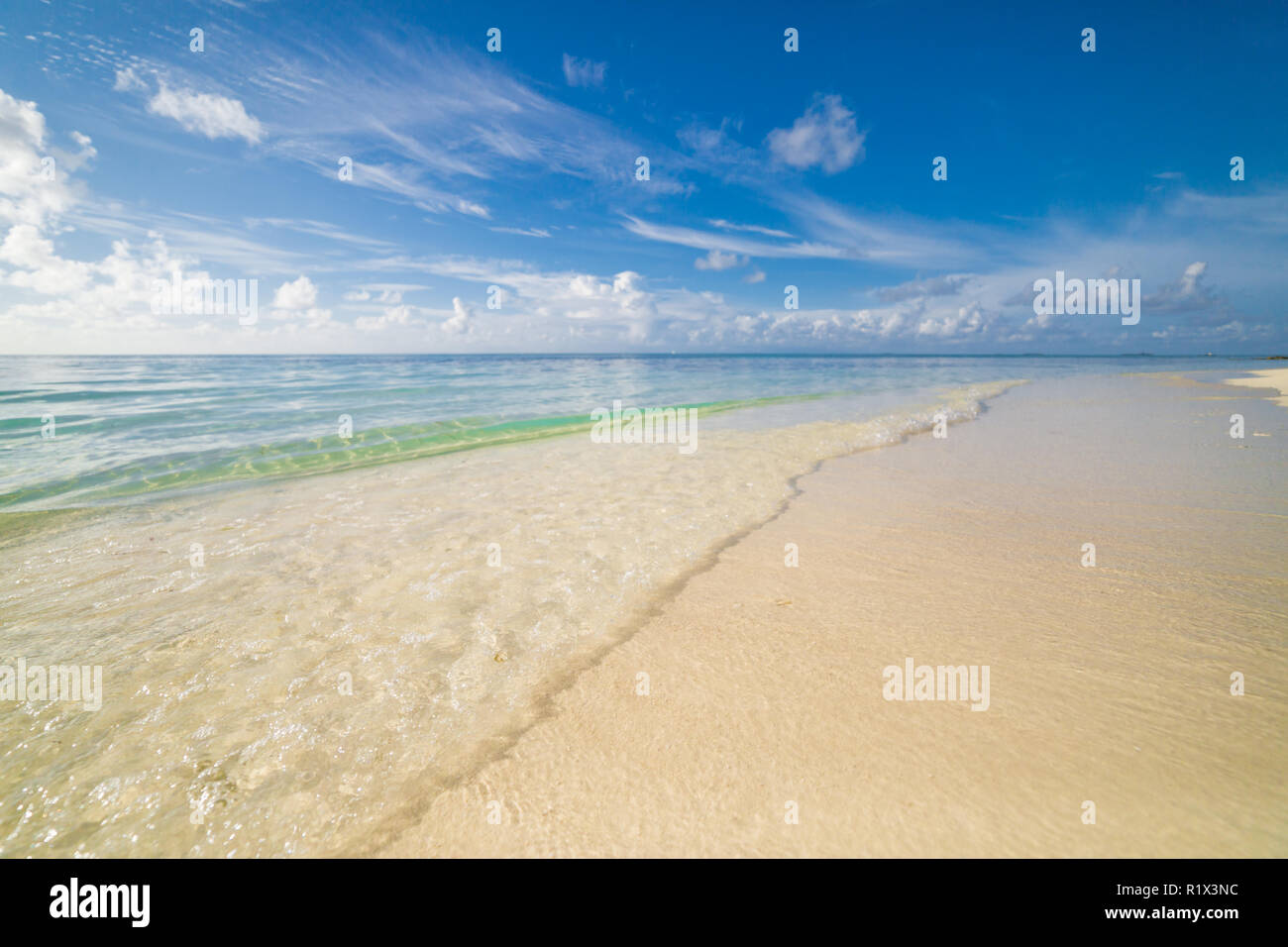 Sea sand sky with soft waves Stock Photo