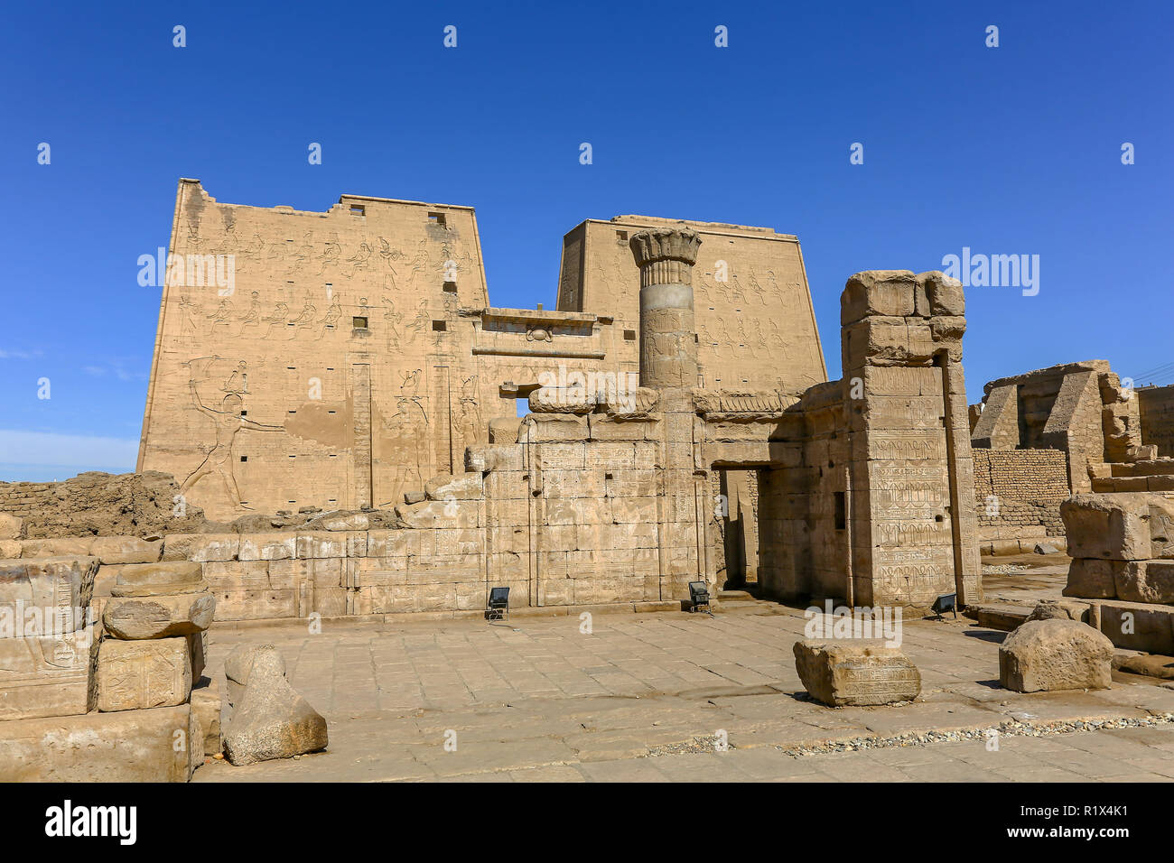 The First pylon at the Temple of Edfu, an Egyptian temple located on the west bank of the Nile in Edfu, Upper Egypt, North Africa Stock Photo