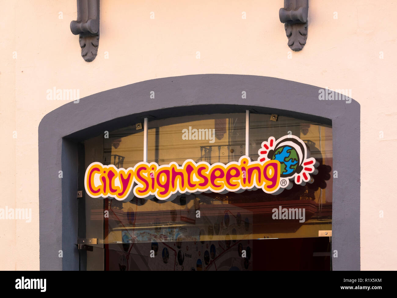 City Sightseeing sign in a window of a shop in Seville, Spain Stock Photo