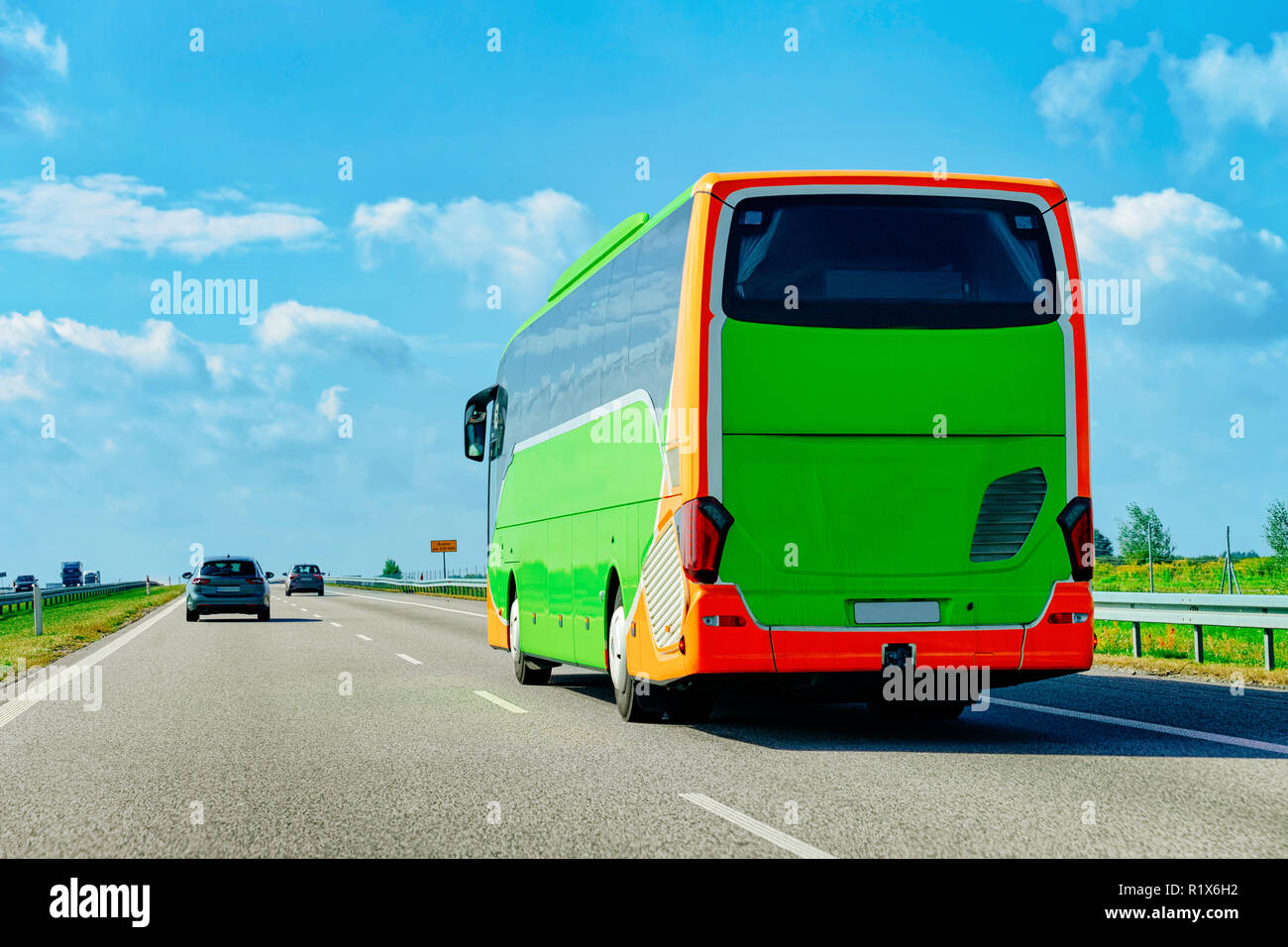 Green Tourist bus on the road in Poland. Travel concept. Stock Photo