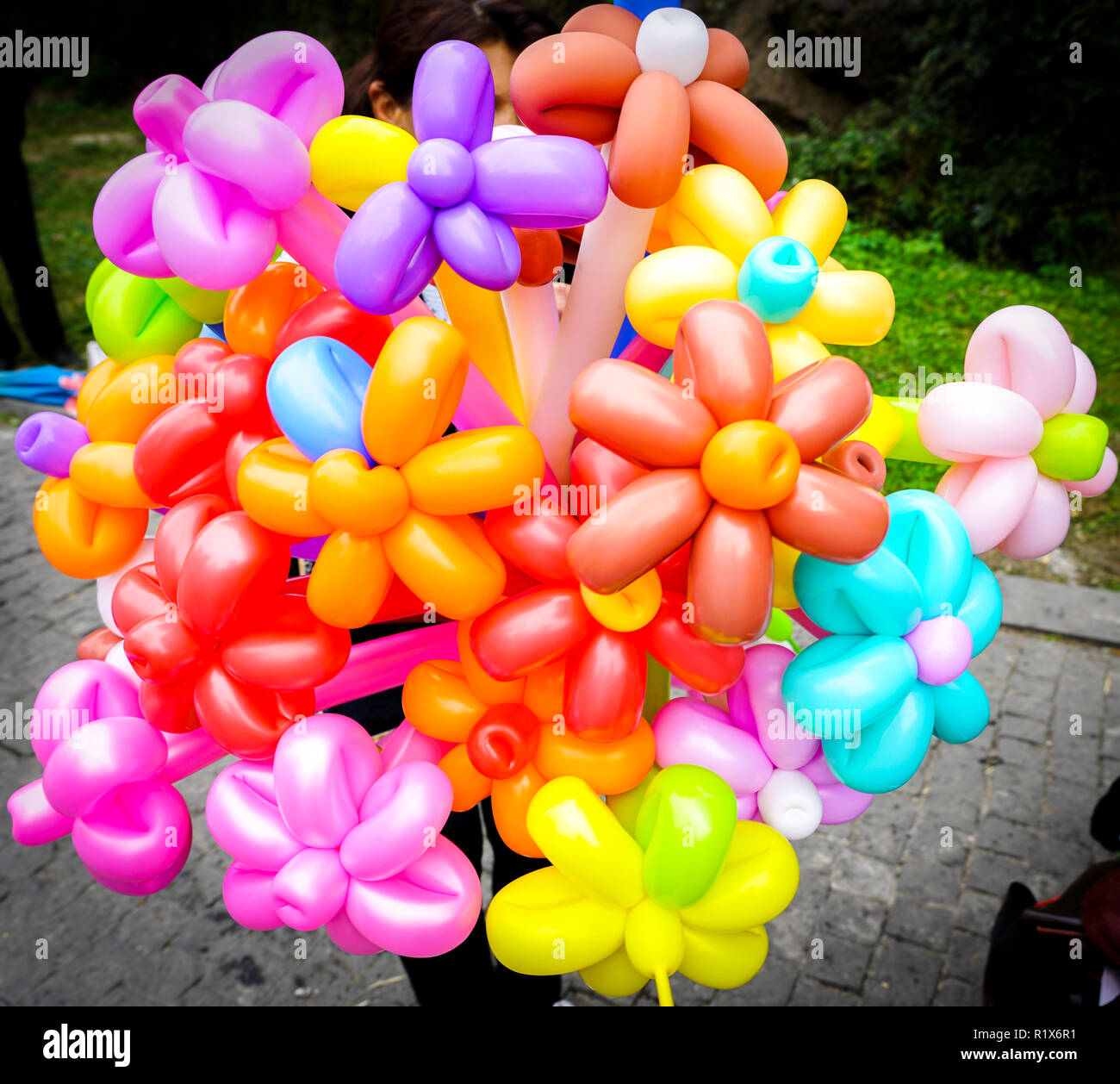 Big bunch of colorful balloons in form of flowers on the streetmarket Stock Photo
