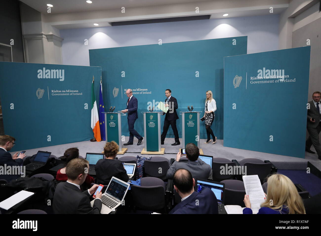 Taoiseach Leo Varadkar, Tanaiste Simon Coveney and Minister for European affairs Helen McEntee enter the stage to speak at a press conference on Brexit at government buildings in Dublin. Stock Photo