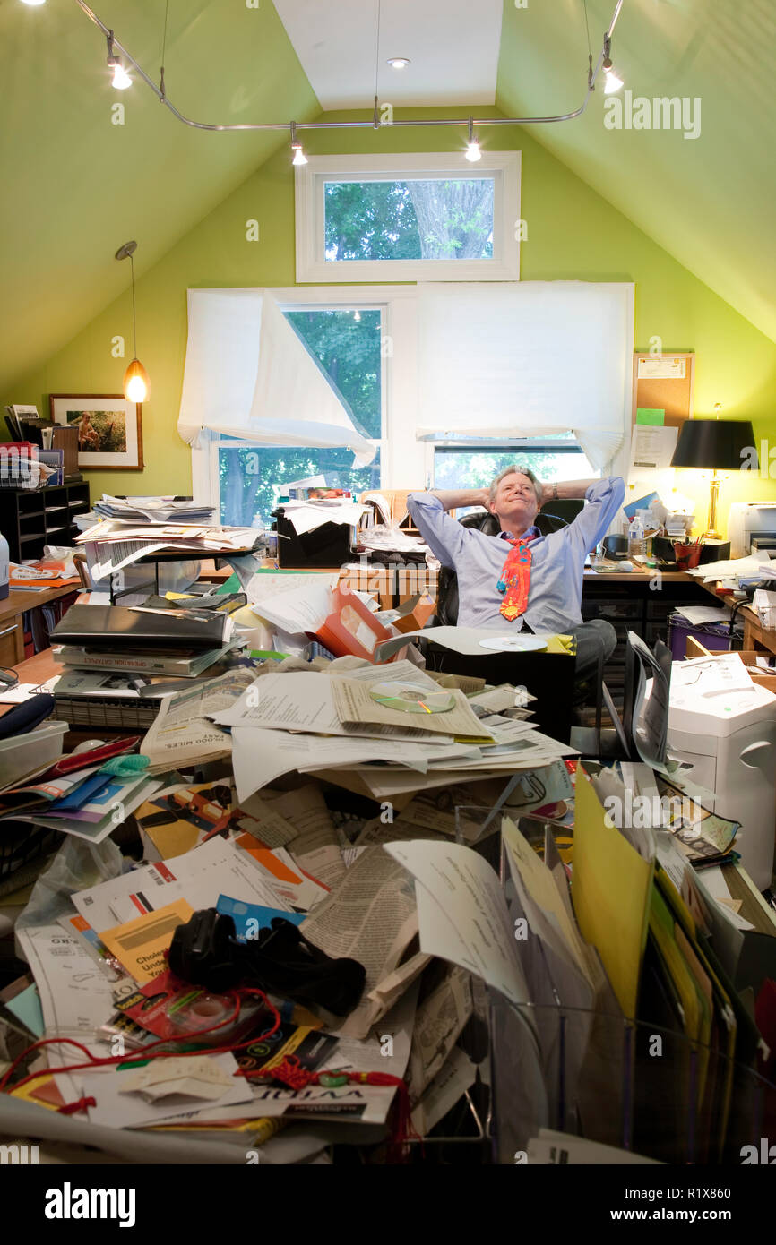Businessman in Hoarder's Messy Home Office, USA Stock Photo Alamy