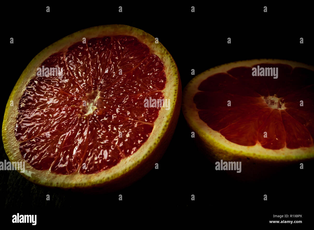 Ruby red grapefruit sliced in half Stock Photo Alamy