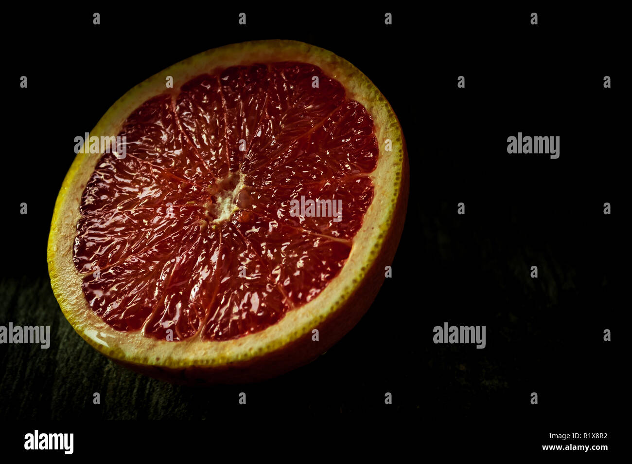 Ruby red grapefruit sliced in half Stock Photo