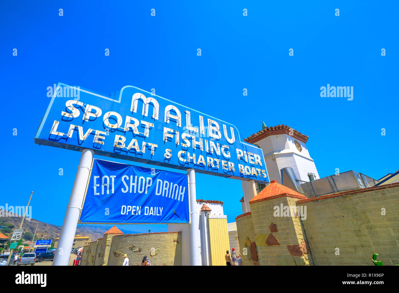 Malibu, California, United States - August 7, 2018: historic Malibu Pier Sign, one of the longest piers in California, on Pacific Coast Highway, 11 miles west of Santa Monica. Sunny day, blue sky. Stock Photo