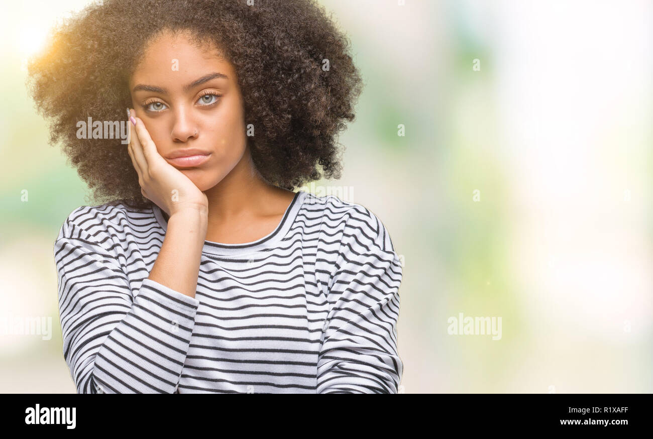 Young afro american woman over isolated background thinking looking ...