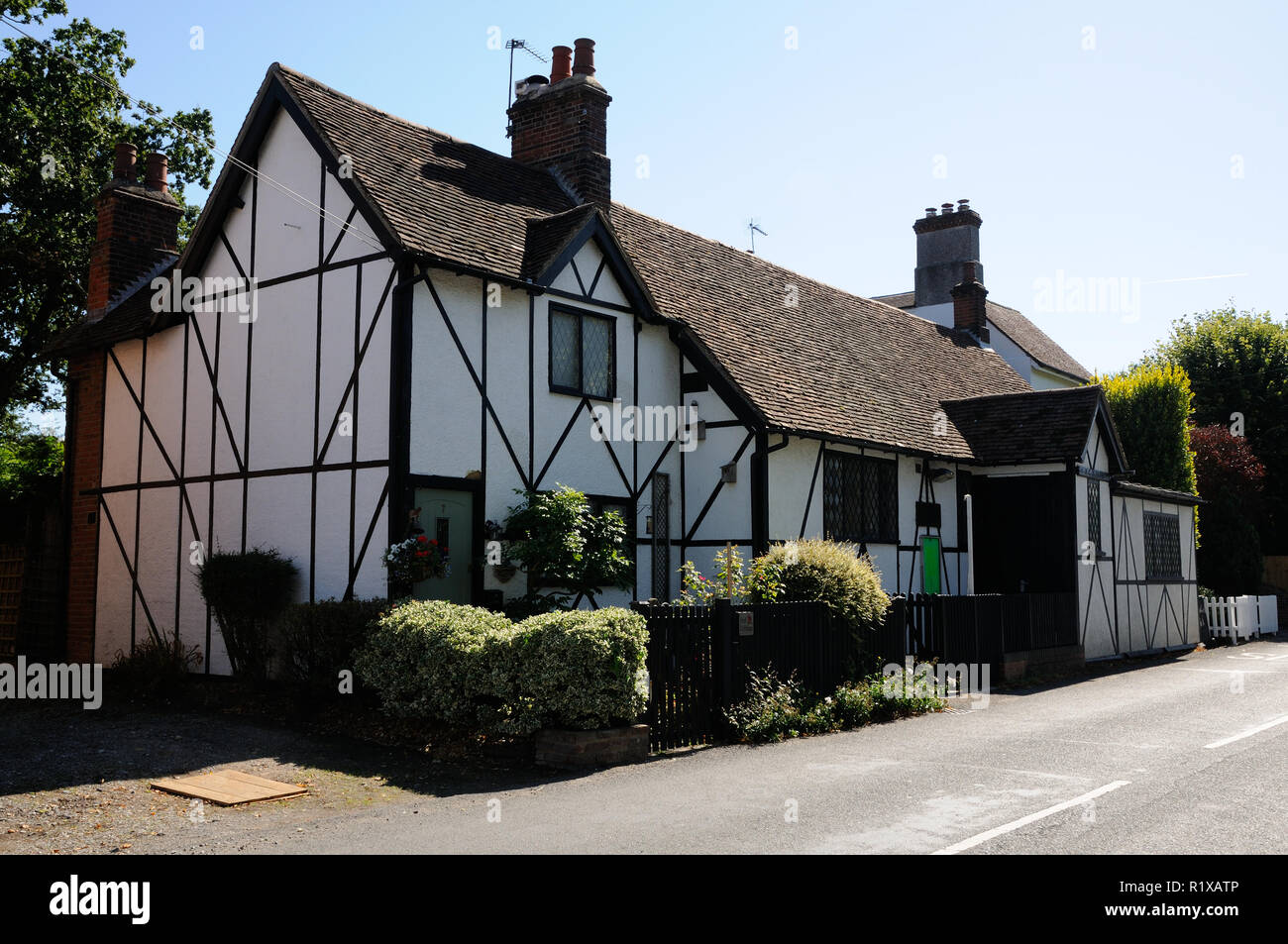 Village Hall., Little Berkhamsted, Hertfordshire, is a white building with timbers, and lattice