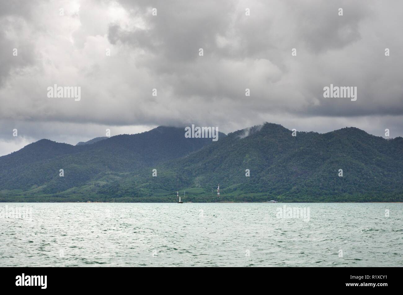 Landscape with tropical sea, monsoon storm heavy clouds and tropical