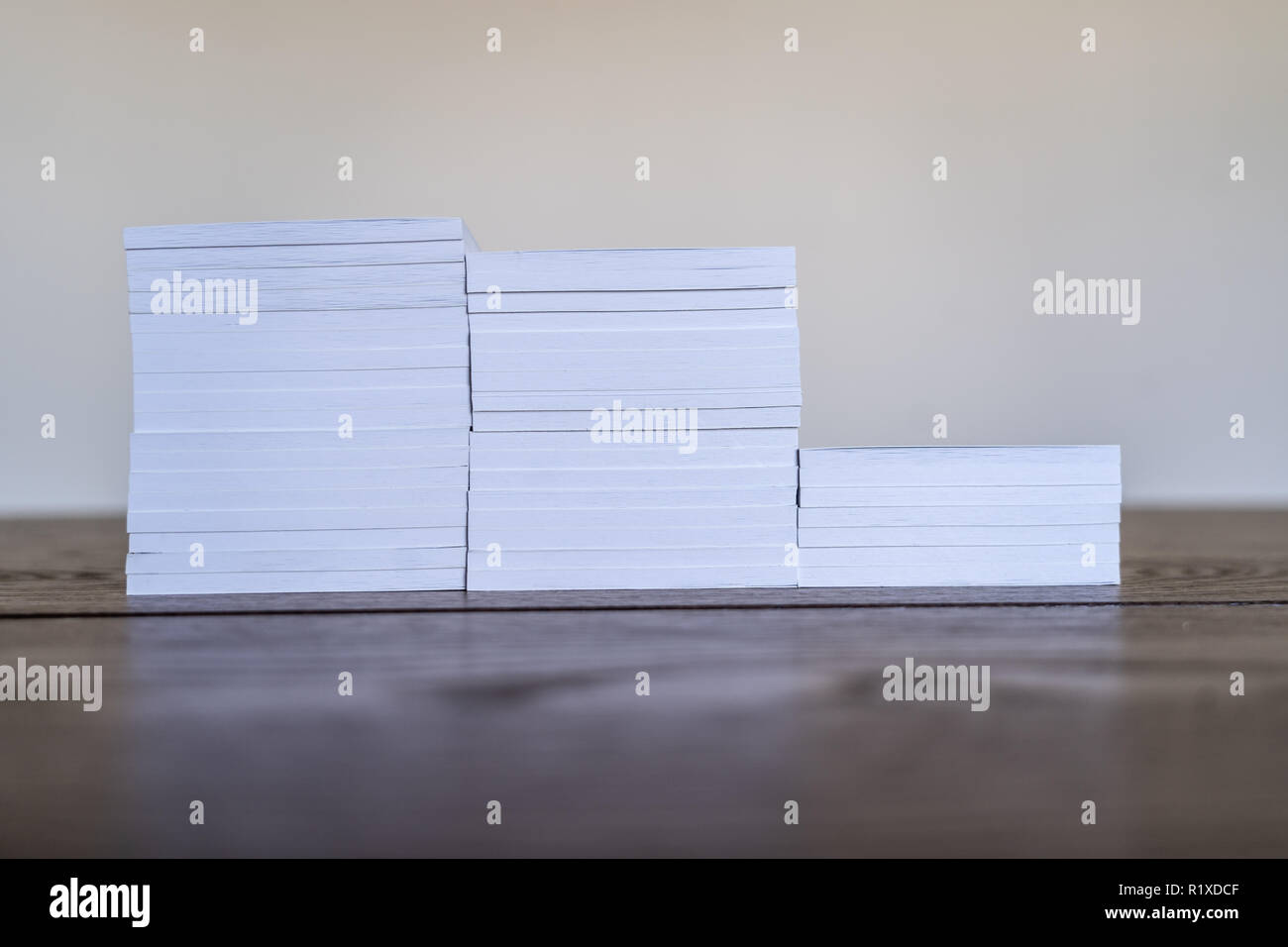 Stacks of Notepads on Office Table to be disributed Stock Photo