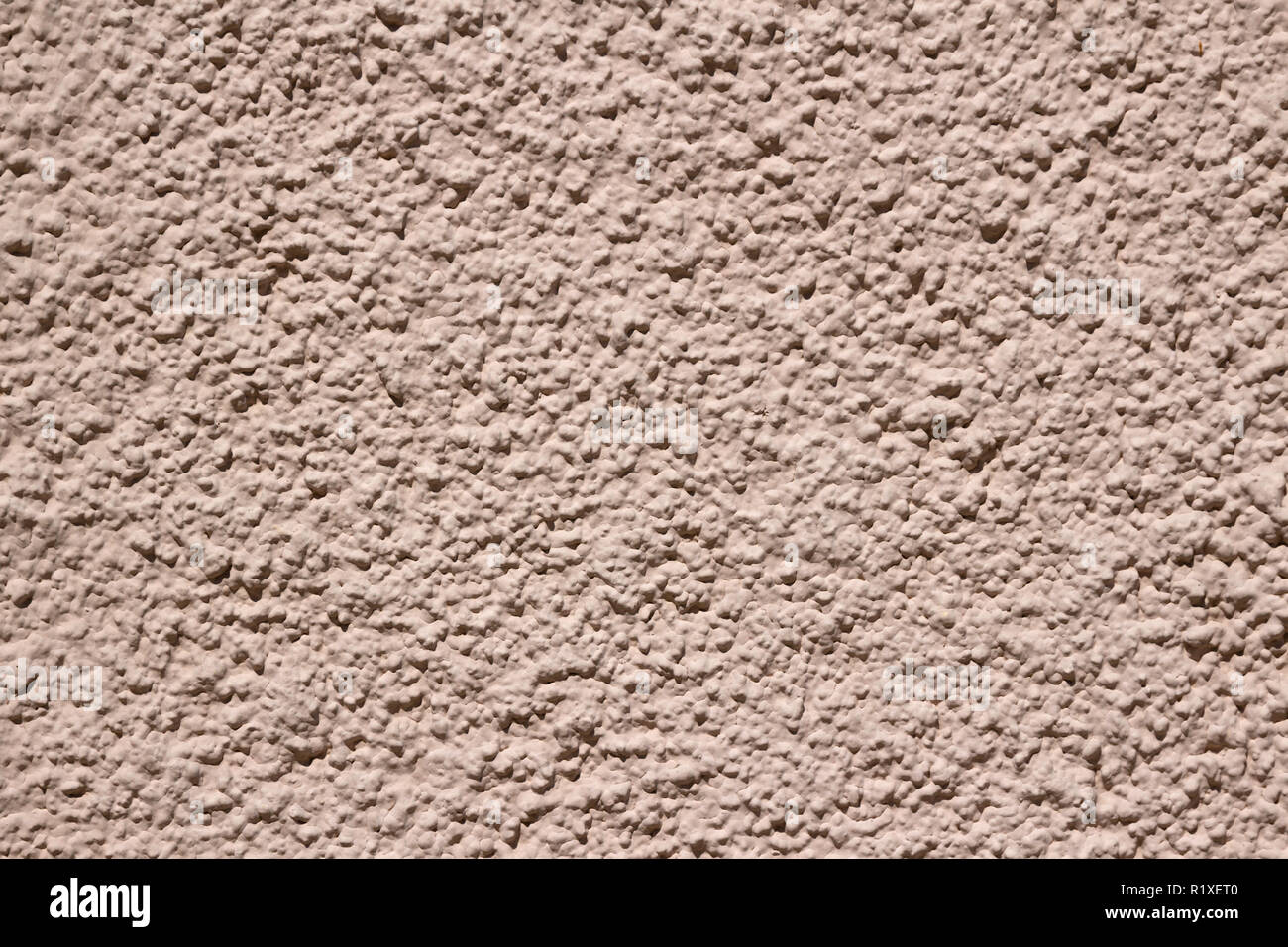 Rugged dark pink plaster wall texture background Stock Photo