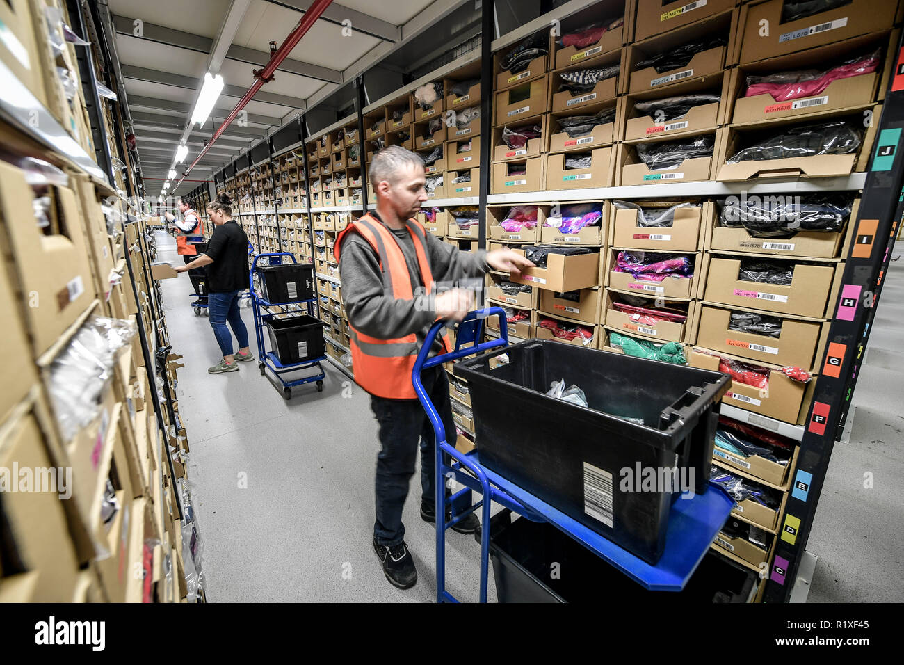 Embargoed to 0001 Friday November 16 Workers pick items from thousands of  clothing racks at Amazon's fulfillment centre in Swansea, in the run up to  Black Friday Stock Photo - Alamy