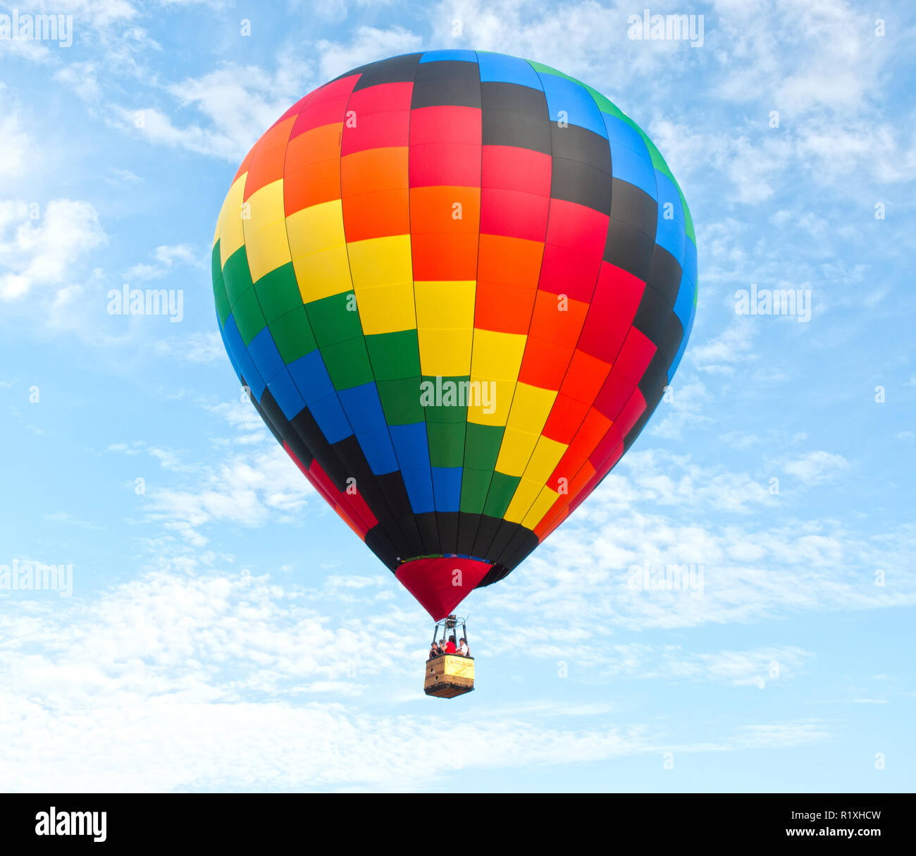 Among the clouds and fresh air this balloon is afloat. Stock Photo