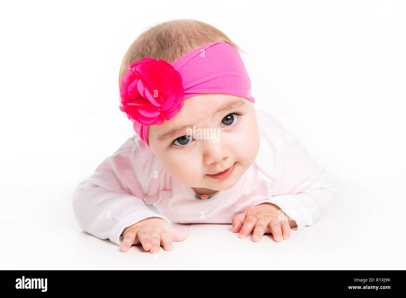 A Portrait of a baby girl isolated on a white background Stock Photo ...