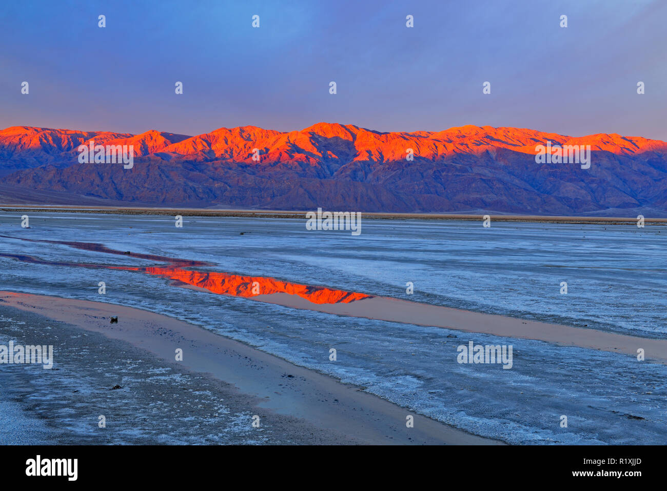 Cottonball Basin salt flats, channels and Panamint Mountains at sunrise, Death Valley National Park, California, USA Stock Photo