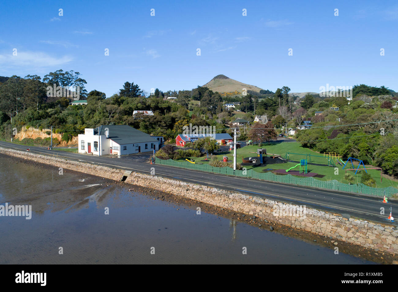 Latham Park and Coronation Hall, Portobello, Otago Peninsula, and Otago Harbour, Dunedin, South Island, New Zealand - drone aerial Stock Photo