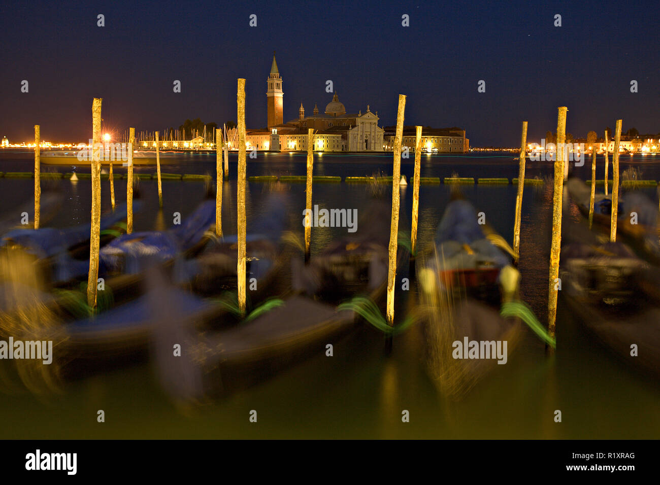 Gondolas moored at San Marco at night, Venice, Italy Stock Photo