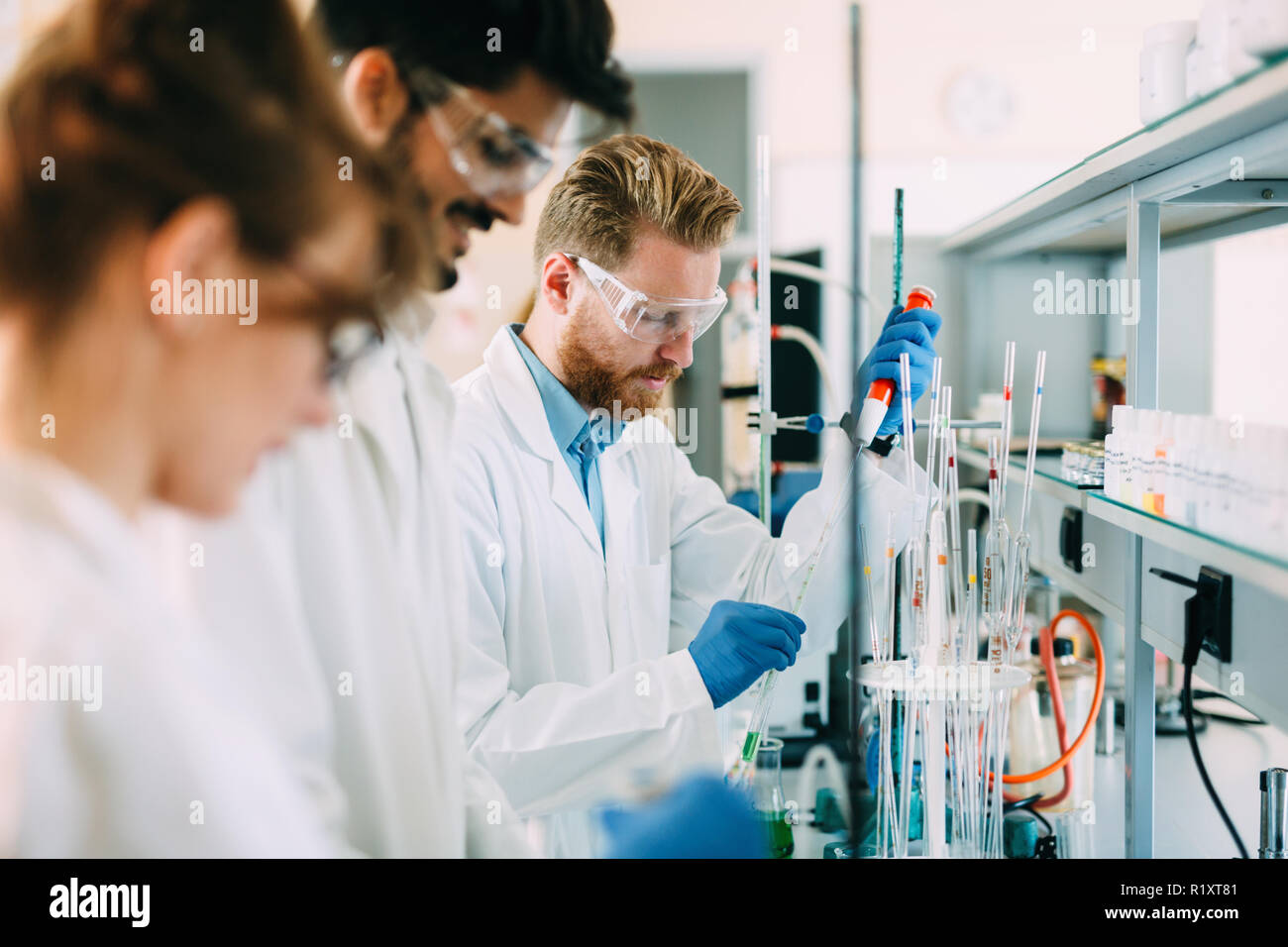 Group of chemistry students working in laboratory Stock Photo Alamy