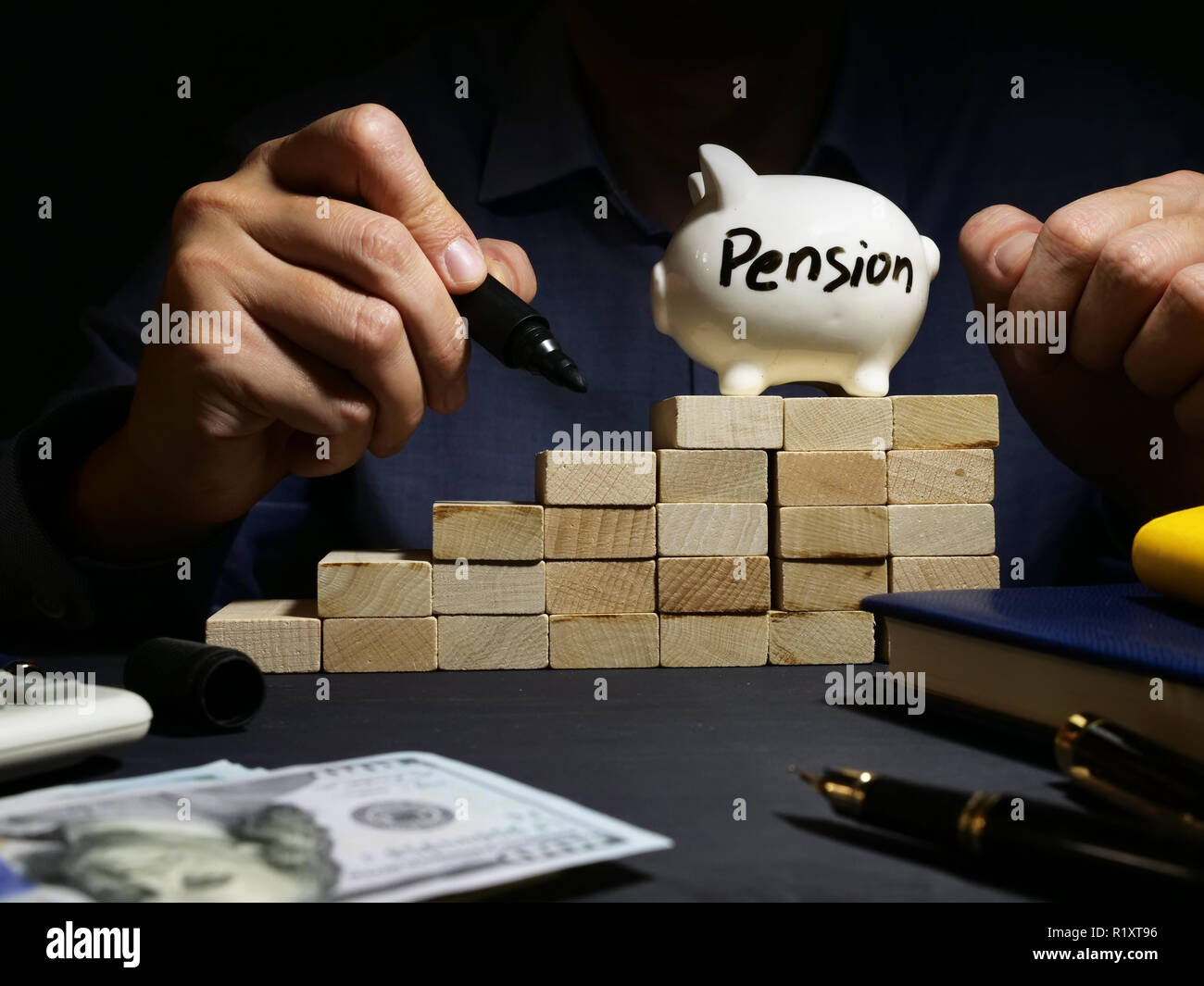 Retirement planning. Pension written on a piggy bank. Stock Photo