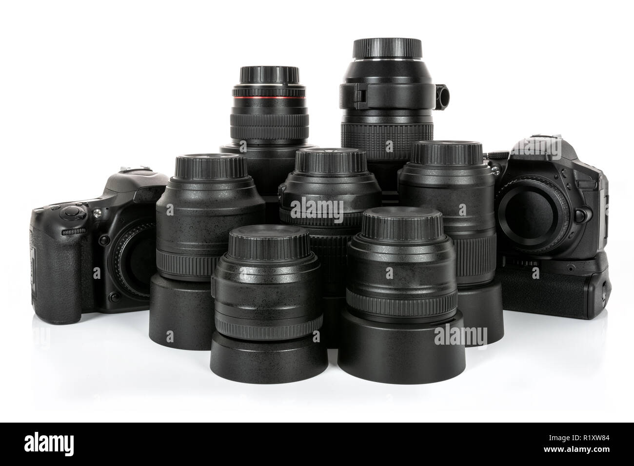 Large collection of professional and modern lenses and DSLR cameras isolated on a white