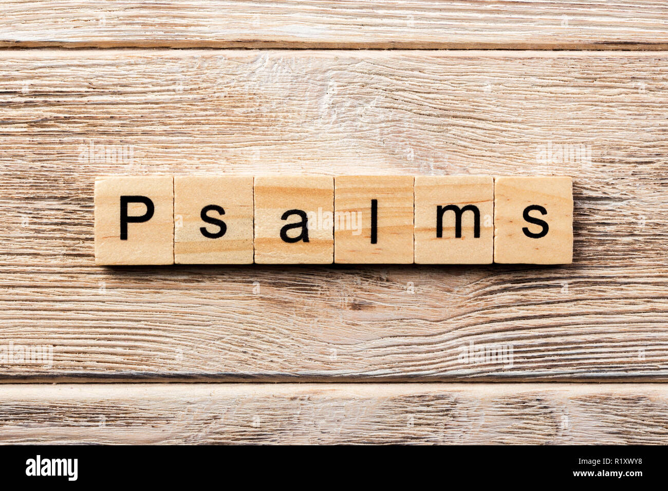 psalms word written on wood block. psalms text on table, concept. Stock Photo