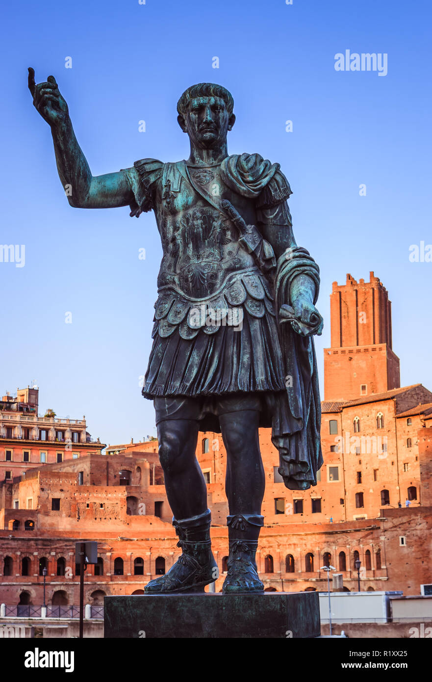 Bronze statue of Julius Caesar, in the Fori Imperiali road at sunset, Rome, Italy Stock Photo