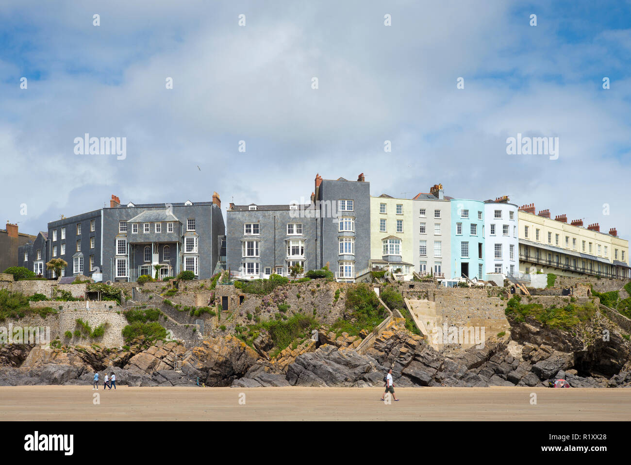 Esplanade - traditional brightly coloured seaside housing, hotels and tourist accommodation above clifftop in resort town of Tenby, Wales, UK Stock Photo