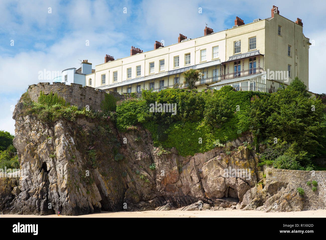 Esplanade - traditional brightly coloured seaside housing and tourist accommodation above clifftop in resort town of Tenby, Wales, UK Stock Photo