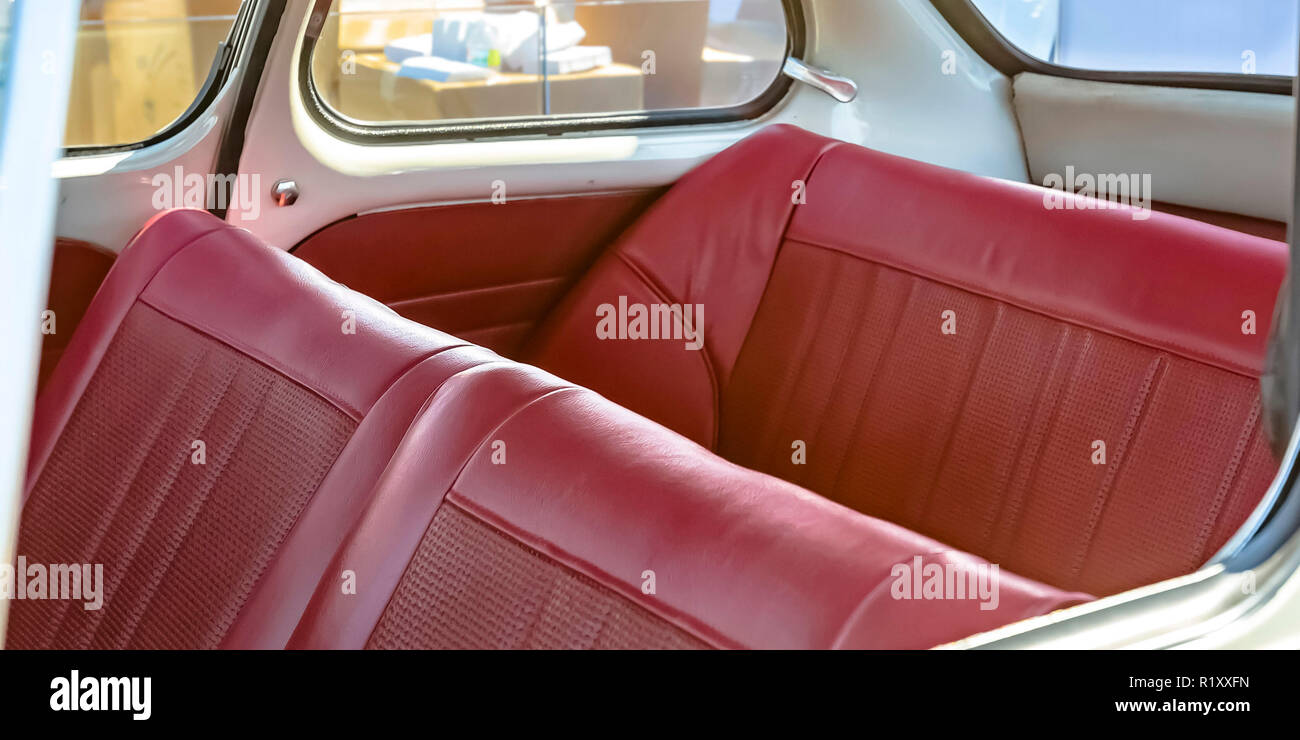 Red leather seats of an old fashioned compact car Stock Photo Alamy