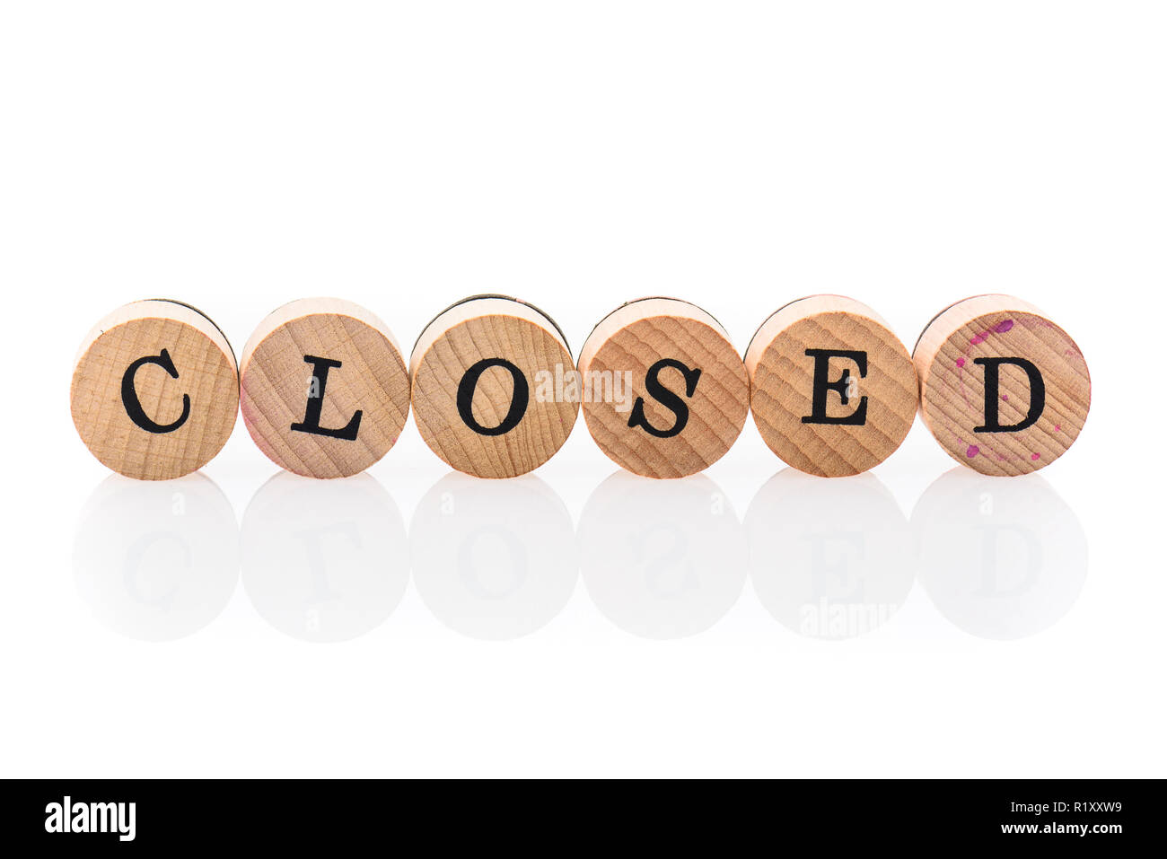 Word Closed from circular wooden tiles with letters children toy