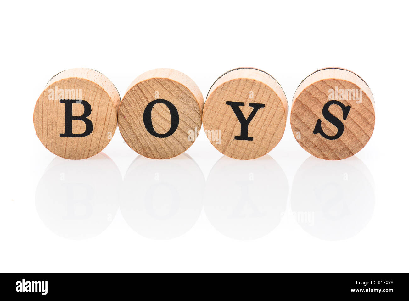Word Boys from circular wooden tiles with letters children toy. Concept