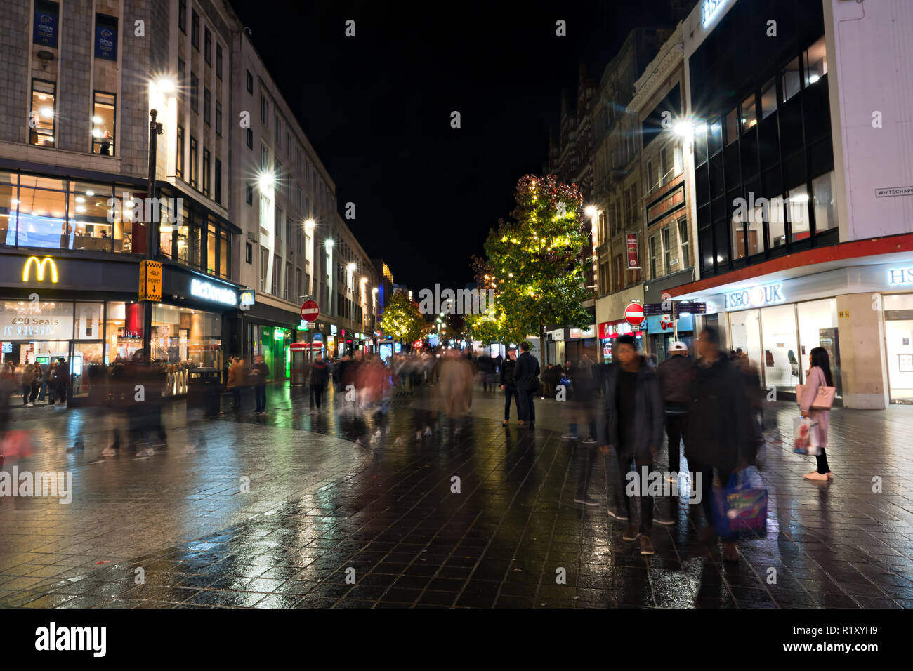 People out shopping at nighttime on Lord St Liverpool UK with Christmas lights on the trees. November 2018. Stock Photo