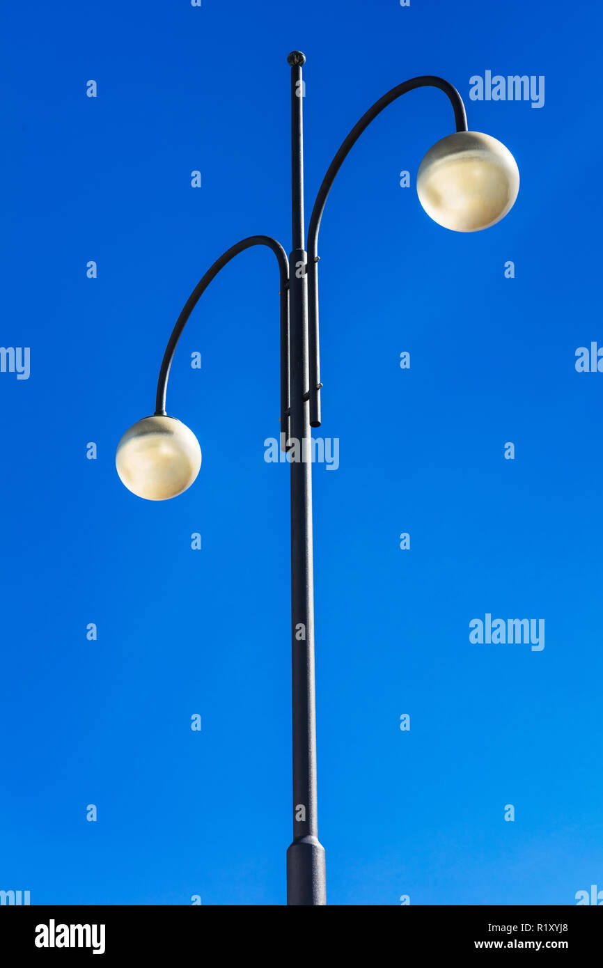street lights on high steel pillars and blue sky Stock Photo Alamy