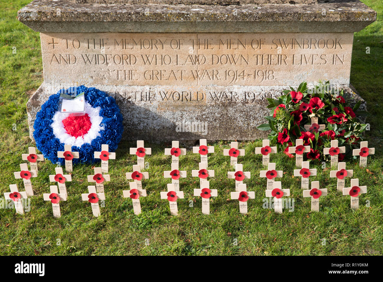 Remembrance wreath and crosses with poppies at war memorial for The Great War 1914-1918 - World War I and World War II 1939-1945 in the graveyard of S Stock Photo