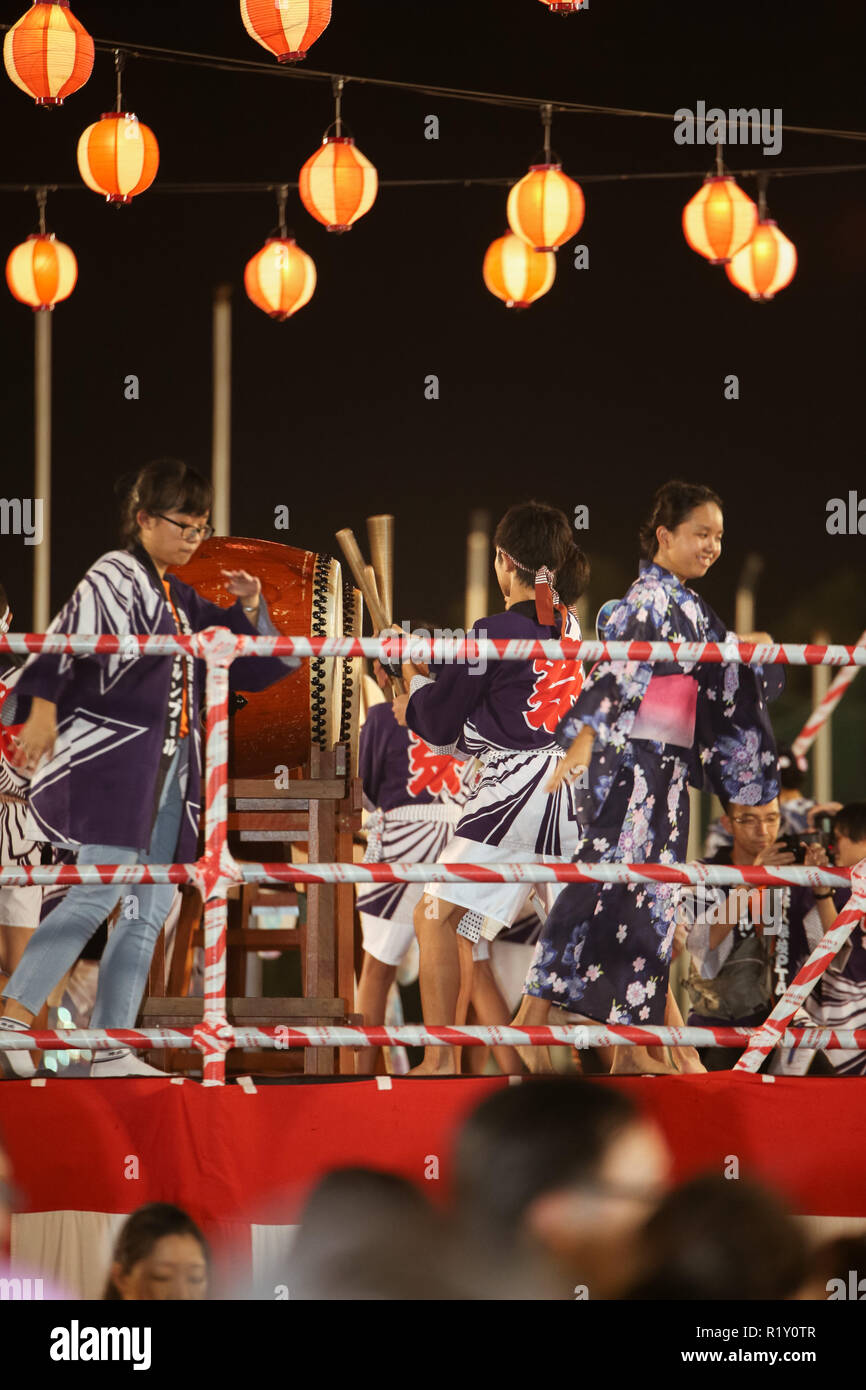 Bon Odori festival dancers and crews performing on stage. Stock Photo