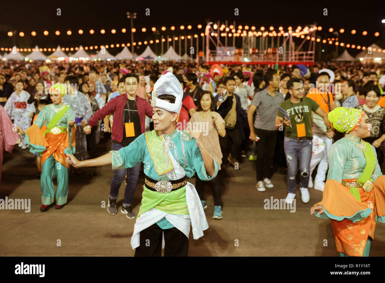 Malay musical dancers performing in the Bon Odori festival to offer cultural variety to the festival. Stock Photo