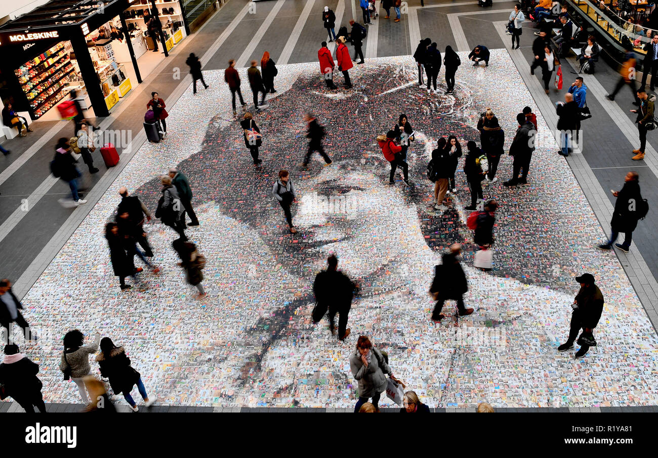 Birmingham, UK. 15th Nov, 2018. A giant mosaic of a suffragette made up of thousands of selfies and pictures of 'inspiring' women has been unveiled. The 20m (65ft) portrait of Hilda Burkitt is on show at Birmingham New Street station, where she threw a stone at the prime minister's train in 1909. Named Face of Suffrage, the artwork includes 3,724 photos from the public. Artist Helen Marshall said: 'The photo is the face of a smiling Edwardian lady, but her story is far from what we might expect. Credit: Sam Bagnall/Alamy Live News Stock Photo