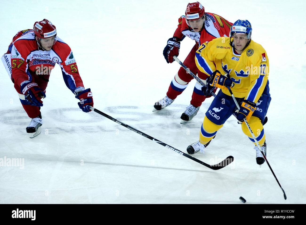 Liberec, Czech republic. 19th Apr, 2009. Euro Hockey Tour, Russia vs Sweden, 6:3, 19 April 2009, Liberec, CZE. Russia's Maxim Goncharov (LL) and Ior Makarov (R) and Sweden's Christian Berglund fight for the puck during their Euro Hockey Tour ice hockey match in Liberec April 19, 2009./PSPA/Slavek Ruta Credit: Slavek Ruta/ZUMA Wire/Alamy Live News Stock Photo