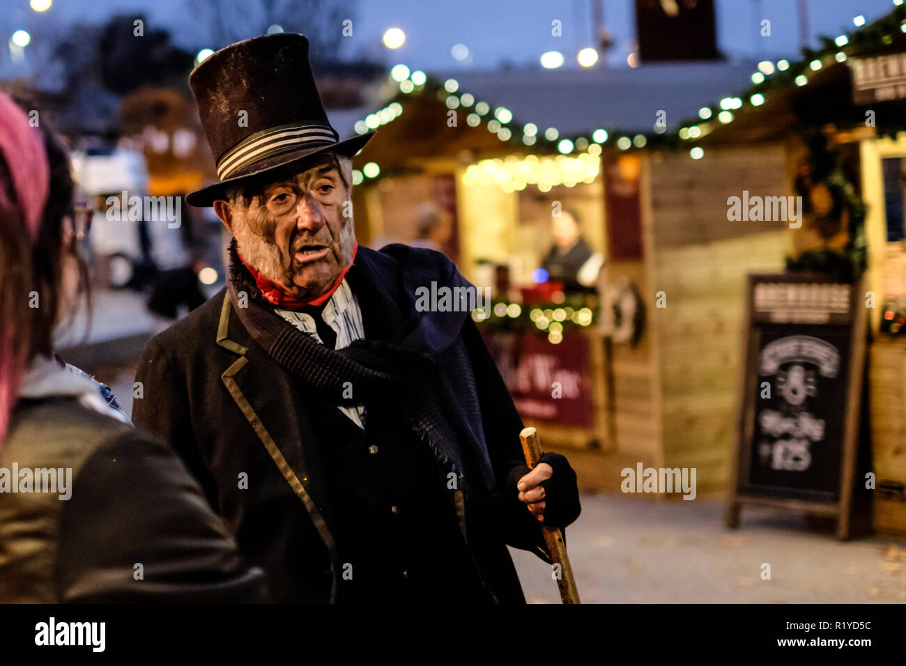Gloucester, UK. 15th Nov 2018. Gloucesters historic market is a draw for visitors and locals. Stall holders dress up in victorian costume to provide a period atmosphere, Mr Burroughs the sweep offers good luck for a handshake and explains the life of a child chimmney sweep Credit: Mr Standfast/Alamy Live News Stock Photo