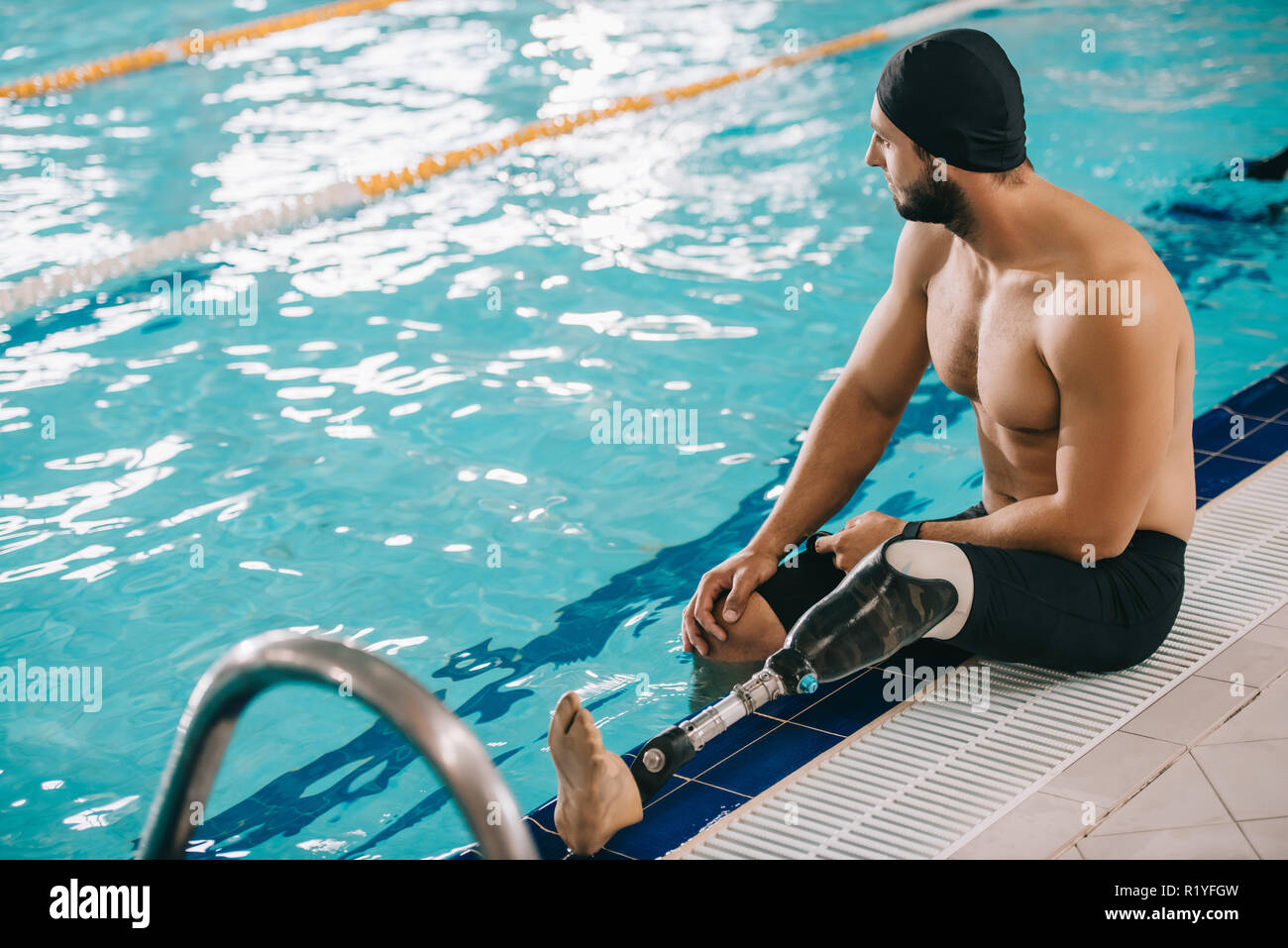Fit swimmer sitting pool hi-res stock photography and images - Alamy