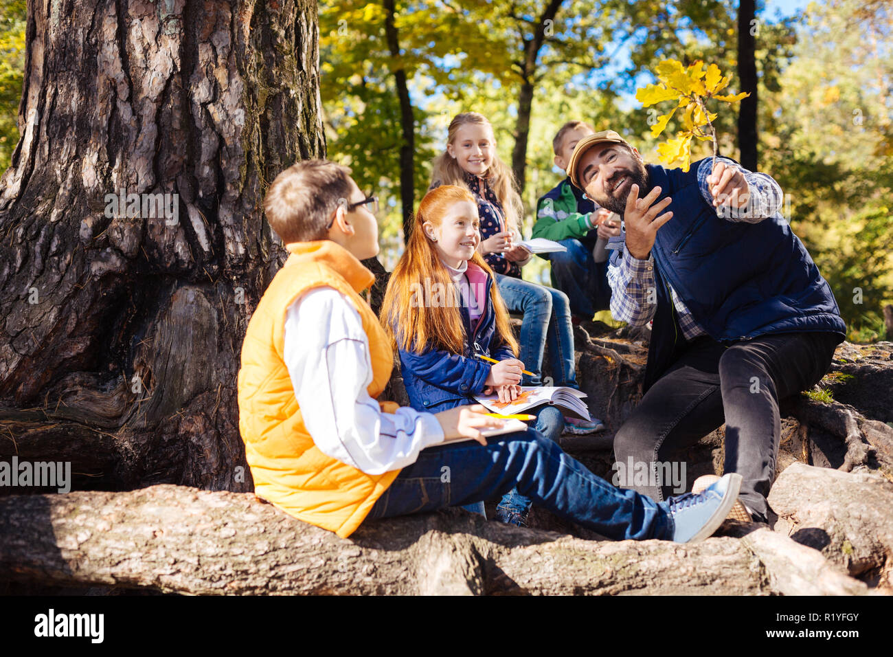 Delighted bearded man telling an interesting story Stock Photo