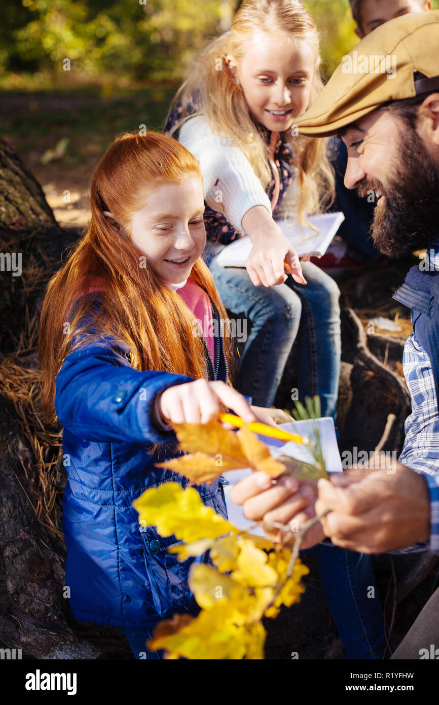 Nice red haired girl feeling very excited Stock Photo