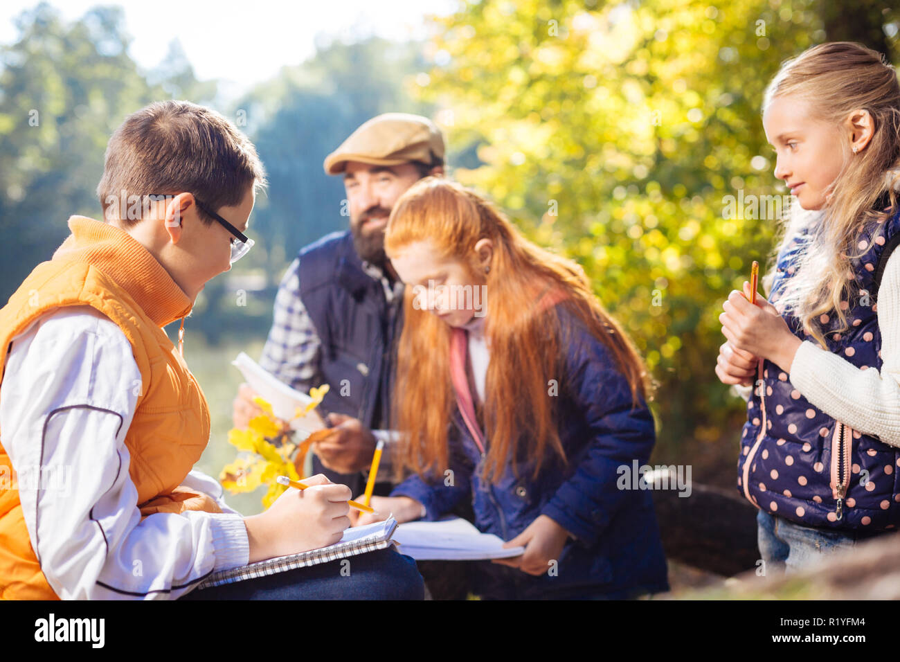 Nice cute smart boy holding a pen Stock Photo